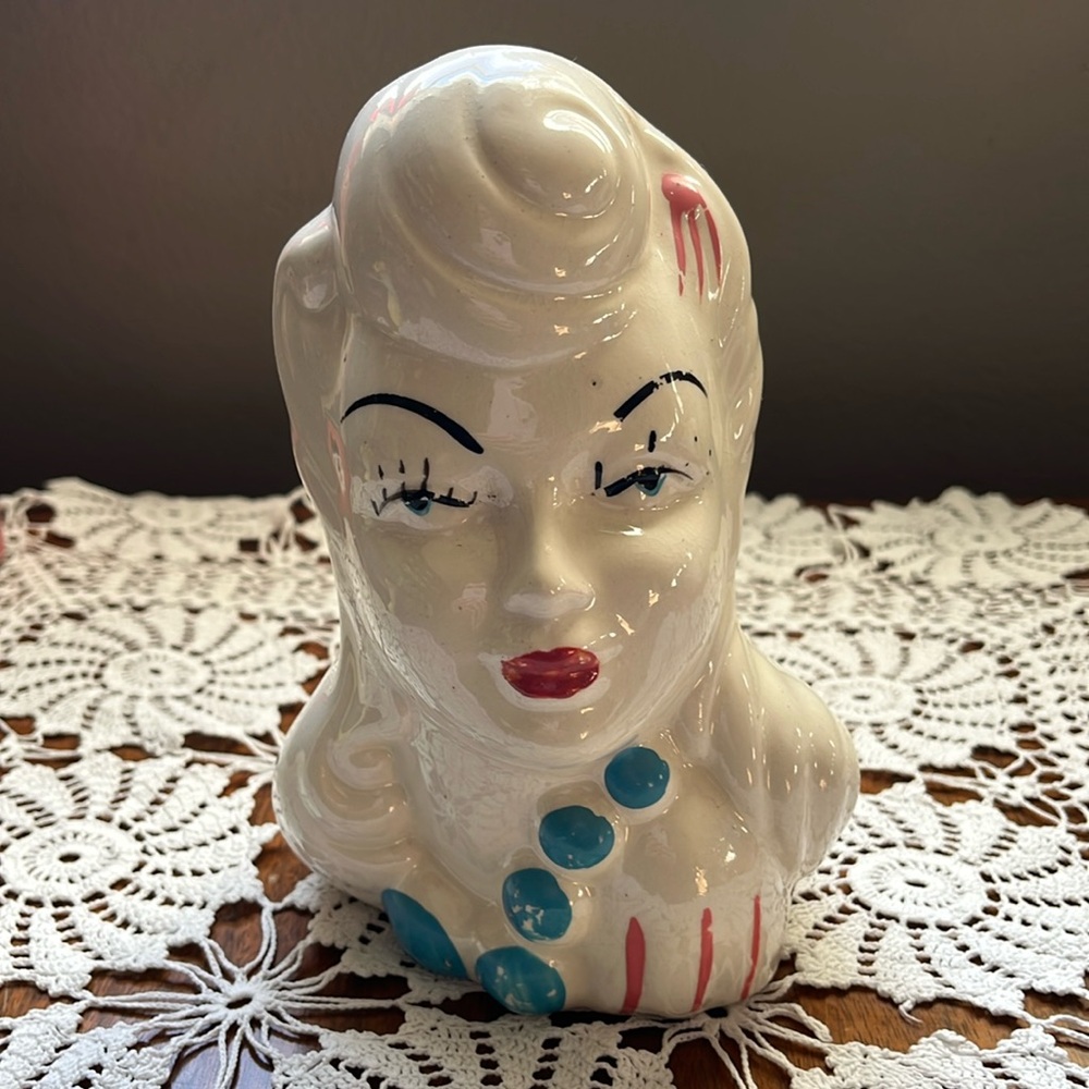 Lady head vase. No chips. Excellent shape. Writing on bottom. 7” tall by 4” wide